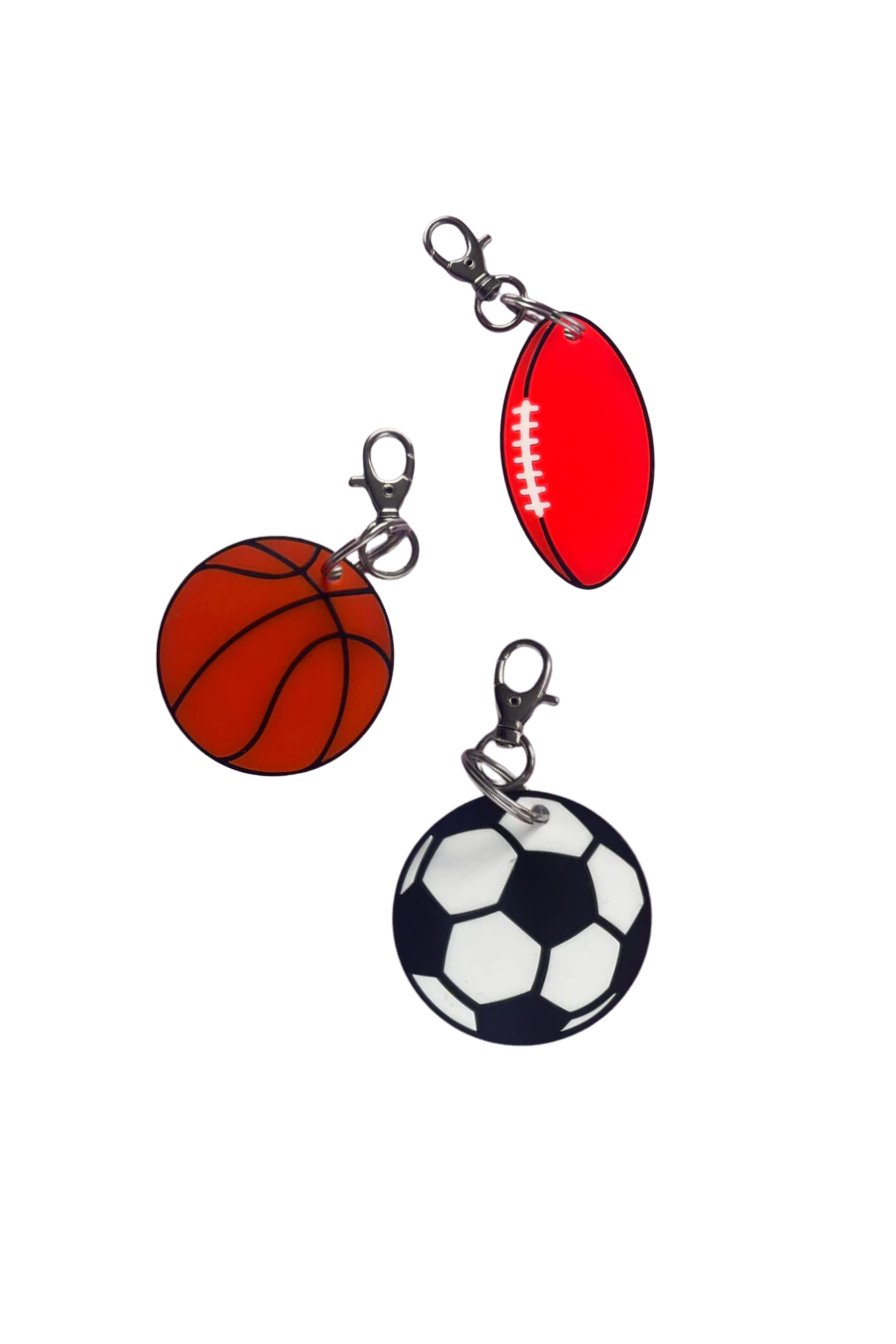 Introducing the Ball Keyrings by HELLO KIT CO—these ideal party favours come in a set of three, featuring an orange basketball, a red American football, and a black-and-white soccer ball. Each keyring is designed with durable metal clasps to add sporty charm to your collection against a plain background.