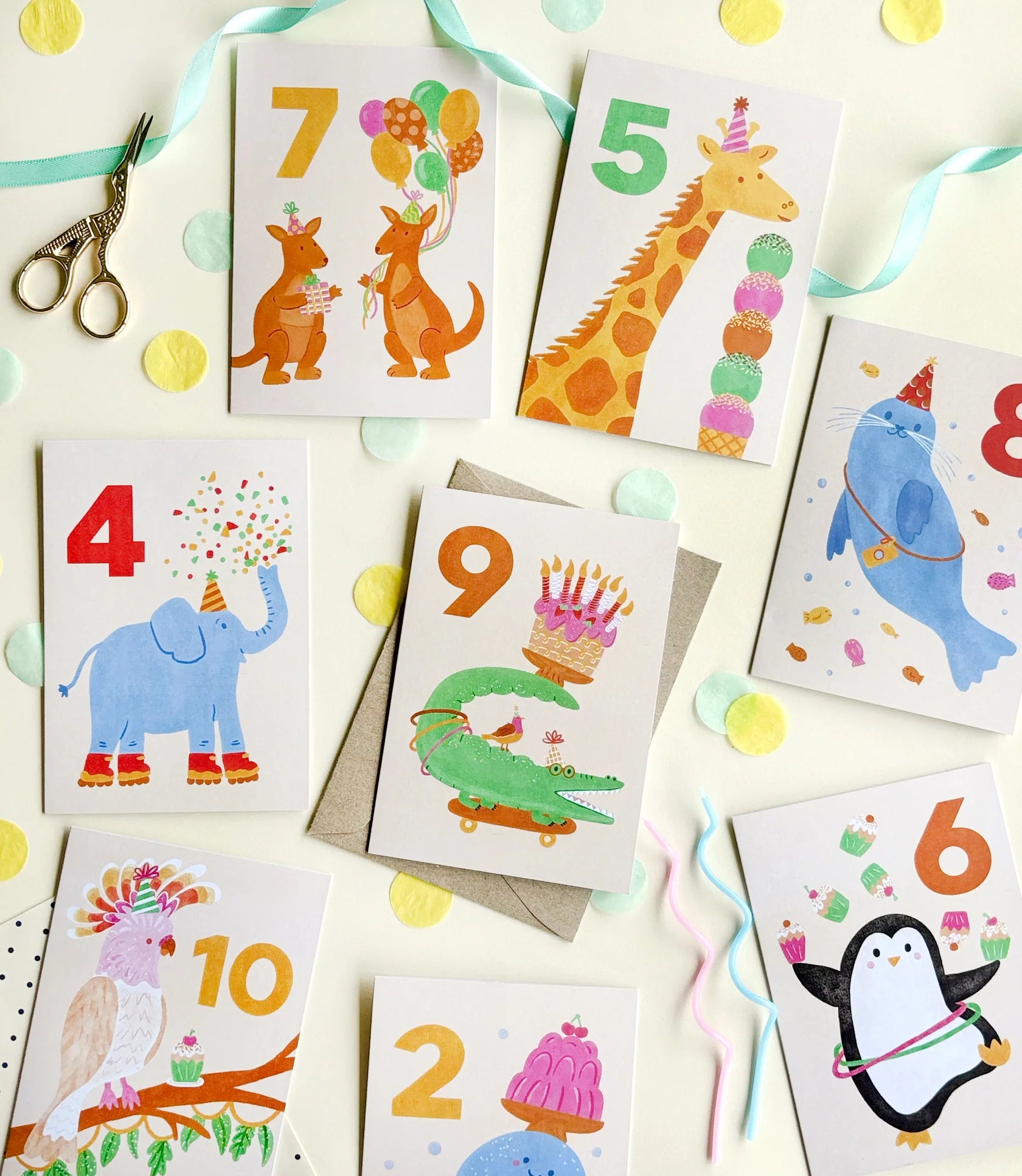 A bunch of birthday milestones cards with different animals on them.