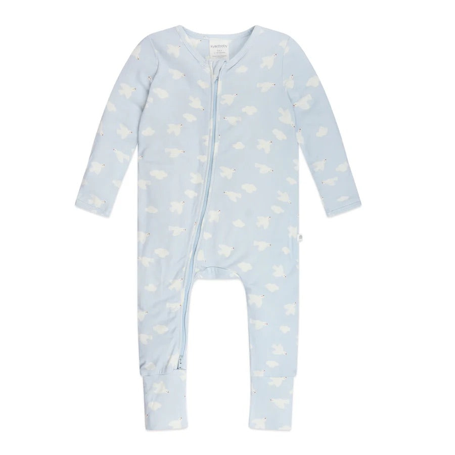 The Day or Night Onesie Bird Song by KYND BABY is a charming light blue baby onesie made from EcoCosy® Viscose. It features an adorable pattern of small white polar bears, complete with a front zipper, long sleeves, and legs for cozy comfort in sustainable fabric.