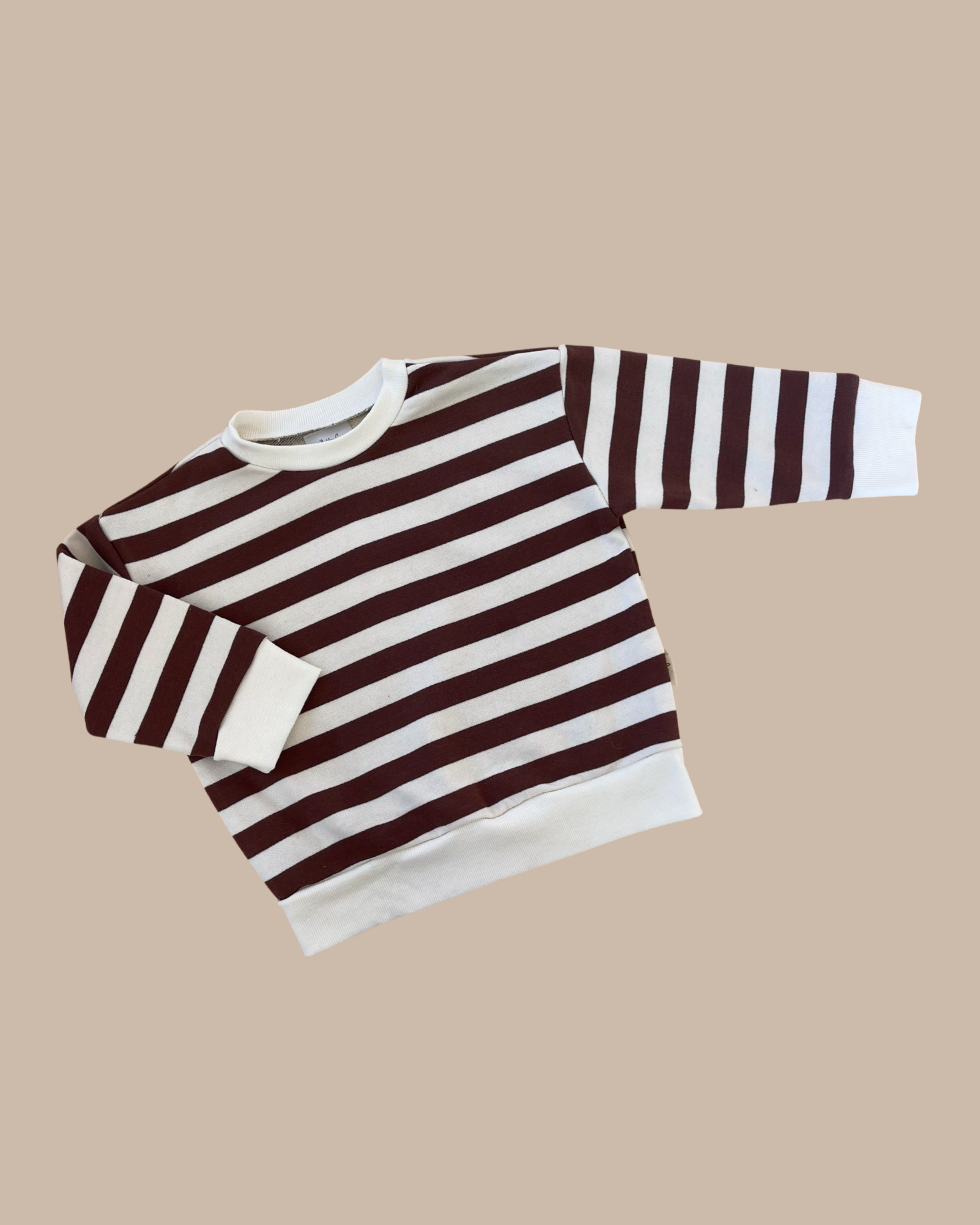 The Camden chocolate brown striped pullover by Bobby G on a light brown background.