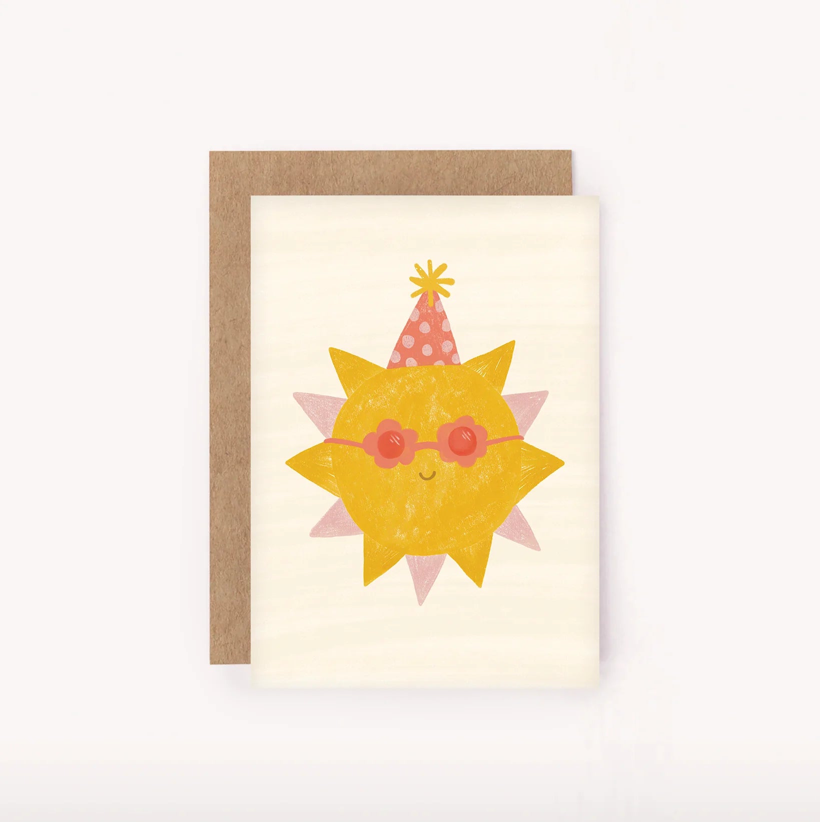 Introducing the Sunshine Mini Card by LAUREN SISSONS STUDIO! Featuring a cheerful yellow sun adorned with red sunglasses and a party hat with pink and white polka dots, this card's minimalist design and pastel colors set the perfect tone for a fun birthday celebration. Paired with a brown kraft envelope, it's printed on recycled paper for an eco-friendly touch.