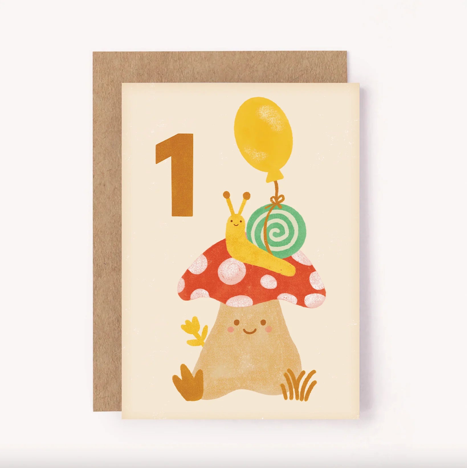 The 1st Birthday Age Milestone Card featuring an illustrated snail with a bright balloon tied to its shell, perched on top of a sweet spotty mushroom A bold hand-lettered number 1 sits on a soft beige background - the colour palette makes it a gender neutral greeting card, ideal for celebrating any child turning one. Blank inside for a personal message.