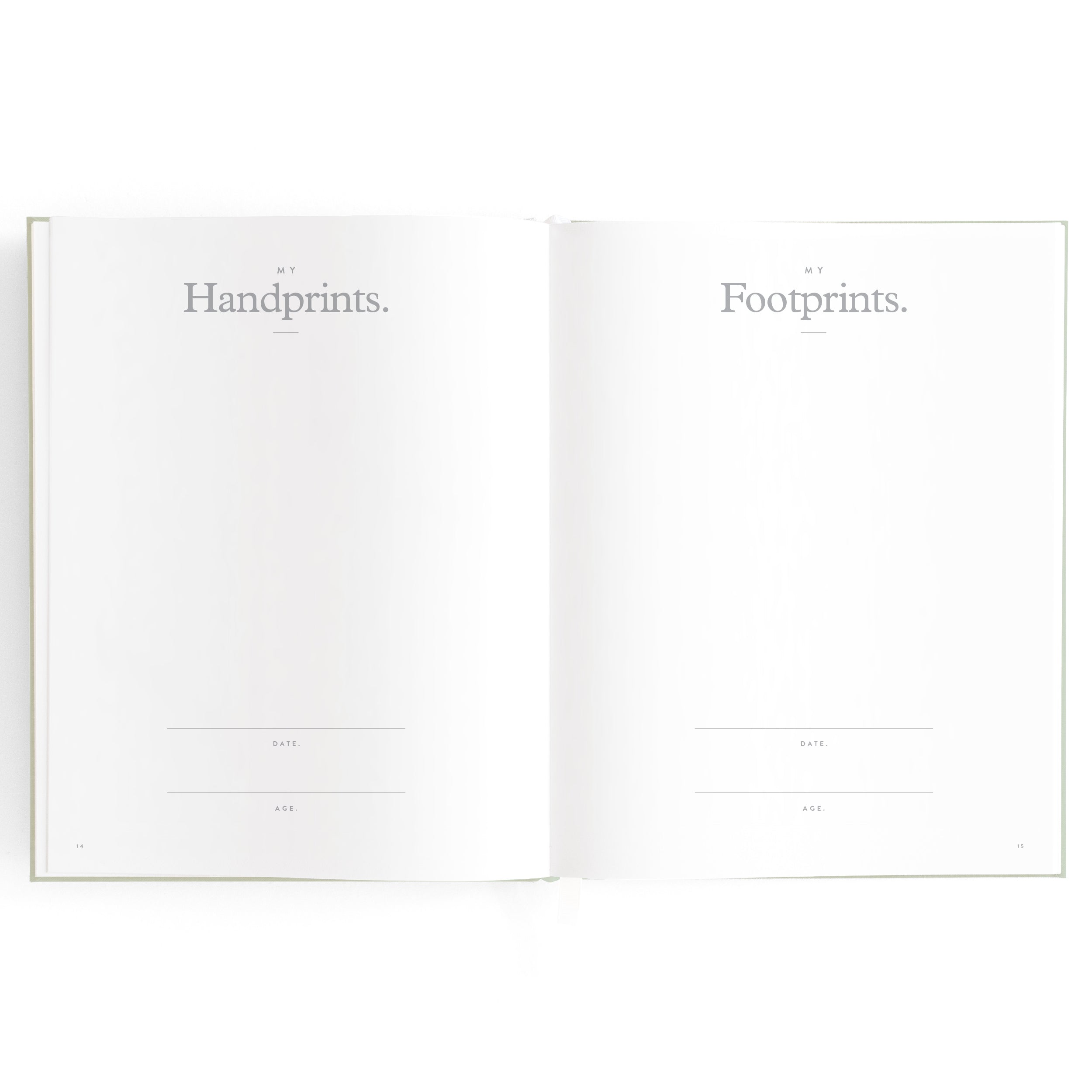 An open book showing two blank pages. The left page is titled "Handprints" with sections for date and age, while the right page is titled "Footprints" with similar sections for date and age. Both pages are otherwise empty, ready to become a cherished family keepsake in your Baby Book Pistachio by FOX & FALLOW.