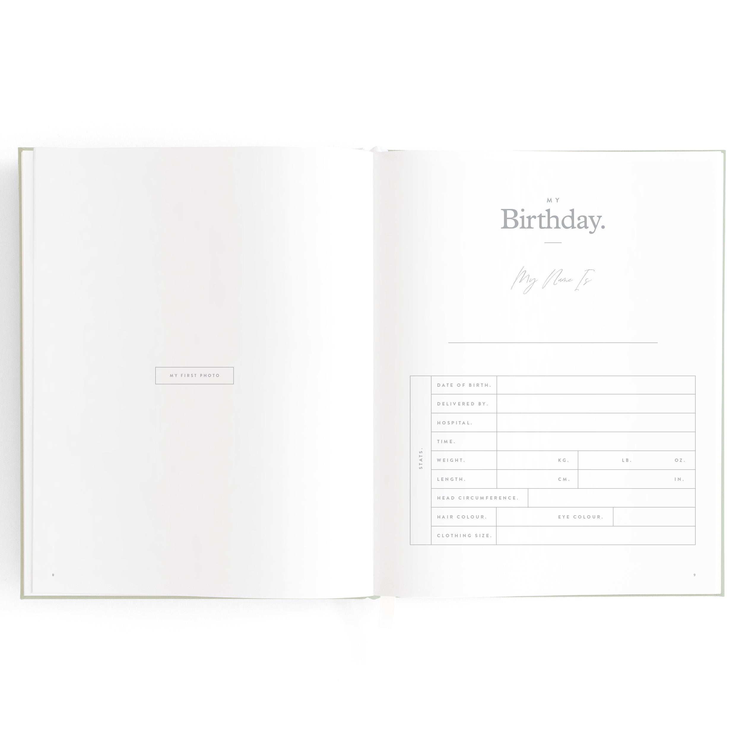 An open Baby Book Pistachio by FOX & FALLOW with a form titled "My Birthday." The form includes fields for various details like age, date of birth, weight, height, head circumference, hair color, and eye color. This milestone book serves as a cherished family keepsake. The left page has a blank section labeled "As your parent."
