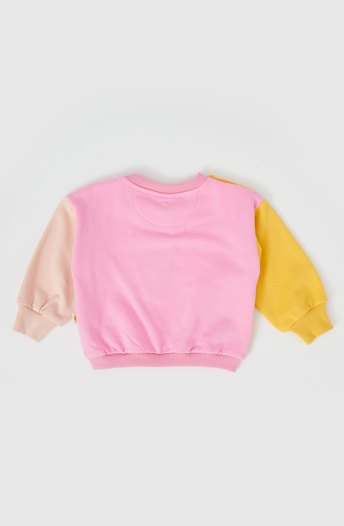 The rio wave sweater in pink/gold.