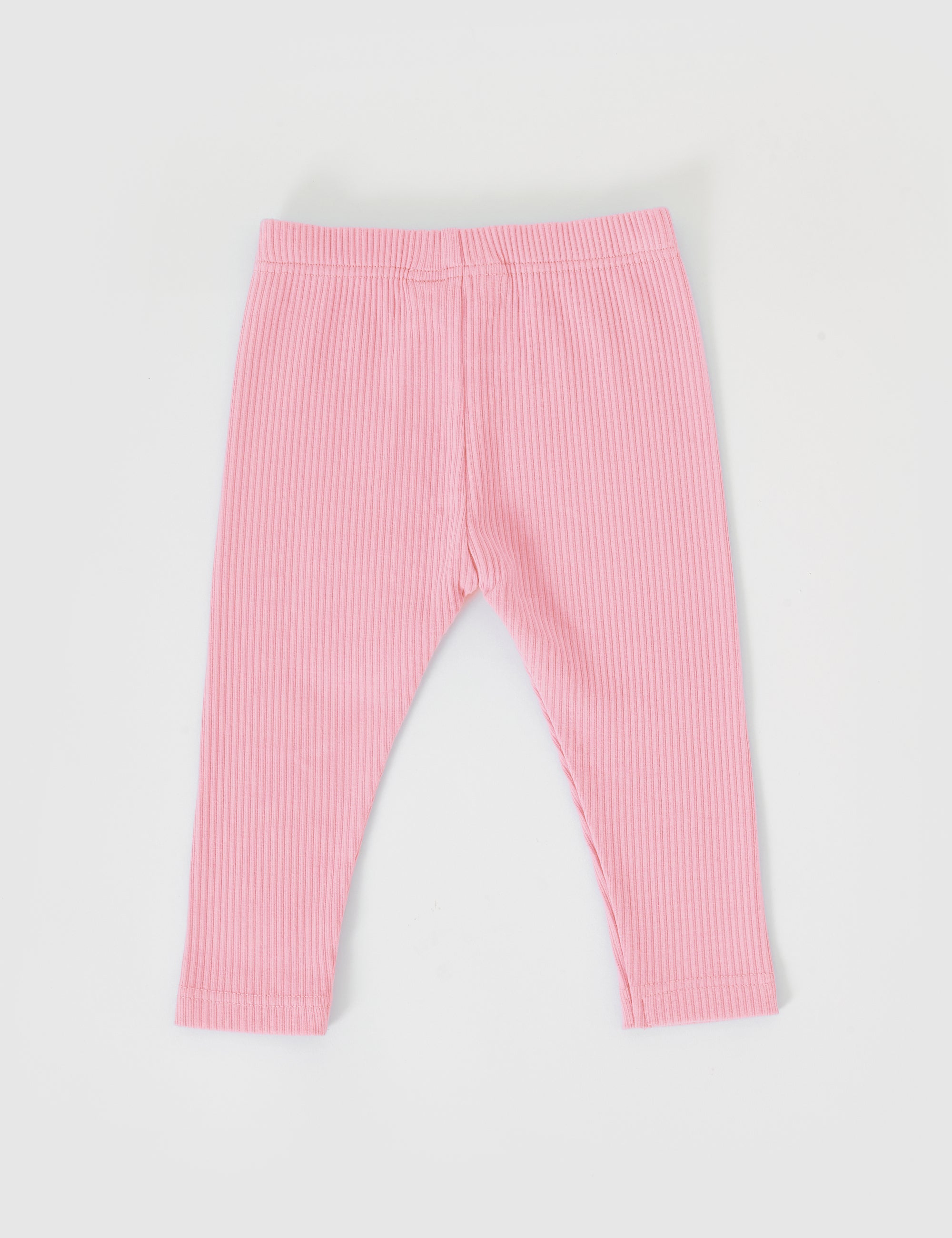 The Goldie + Ace Bowie Rib Legging Sweet Pea by GOLDIE + ACE is showcased on a white background. Made from a cotton/elastane blend, these pink leggings offer an elasticated waistband and simple ankle hems for comfortable stretch, perfect for active toddlers.