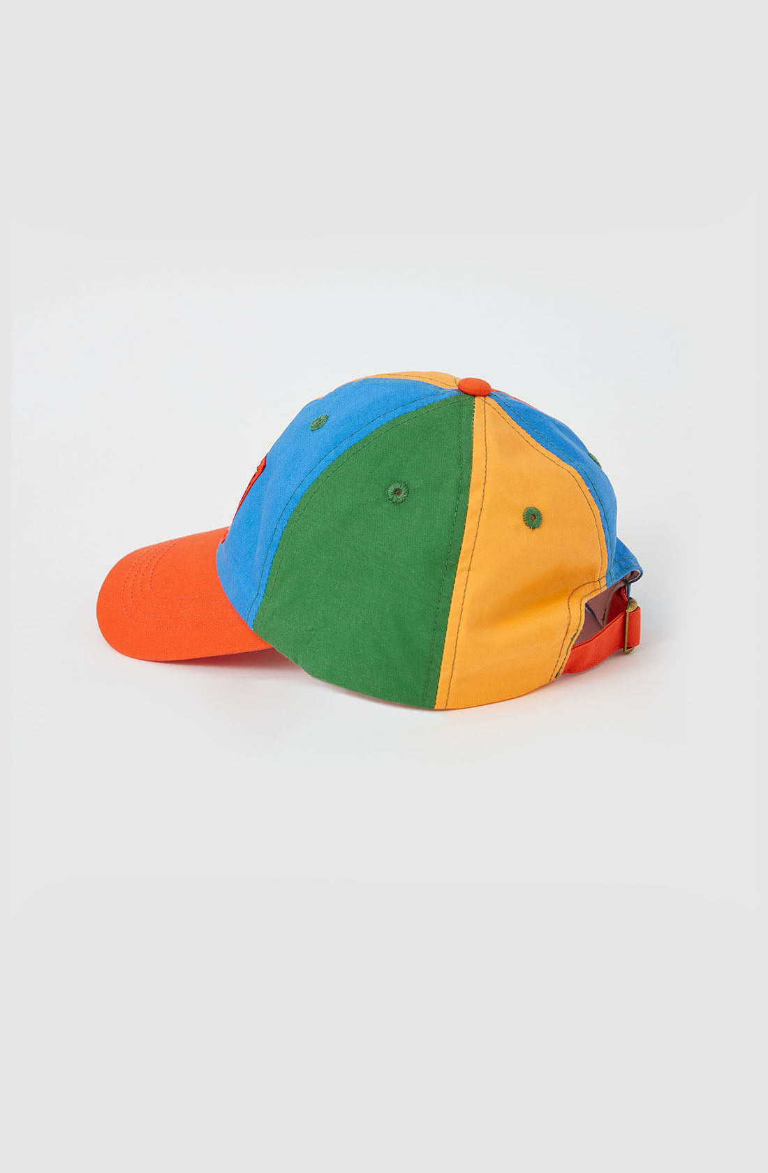 Introducing the Tate Land Down Under Denim Cap by GOLDIE + ACE: A vibrant cotton baseball cap showcasing a segmented design with blue, green, yellow, and orange panels. This cap features an orange brim and a red adjustable strap at the back for a perfect fit. Displayed against a plain white background.