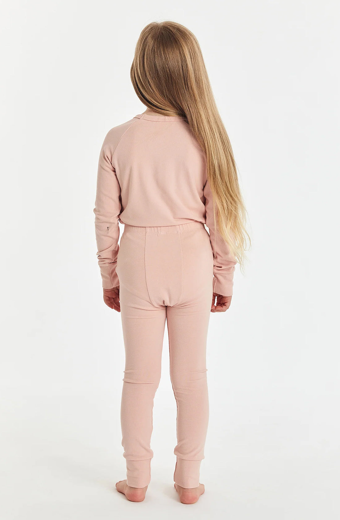 Rear view of girl wearing the sleep set in misty rose