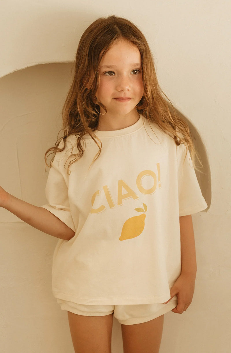 Girl wearing ciao t-shirt untucked over shorts