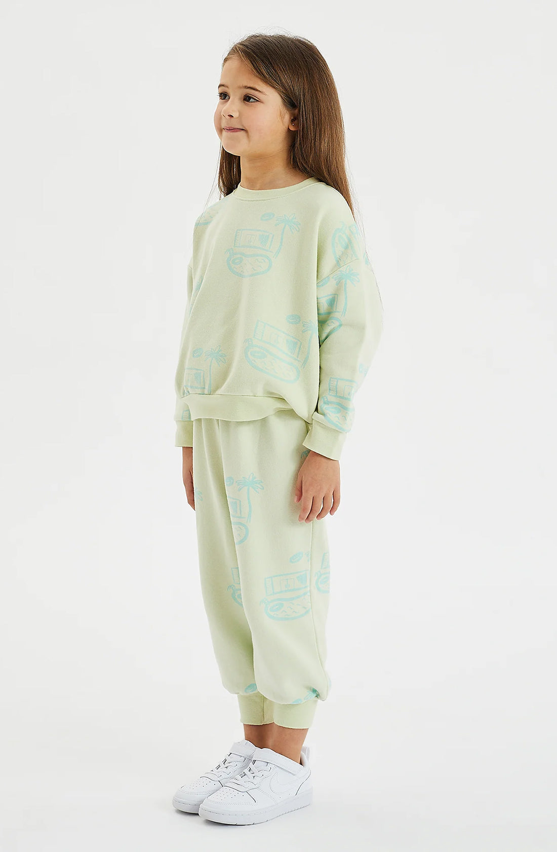 Girl standing on the side wearing the pool house fleece set