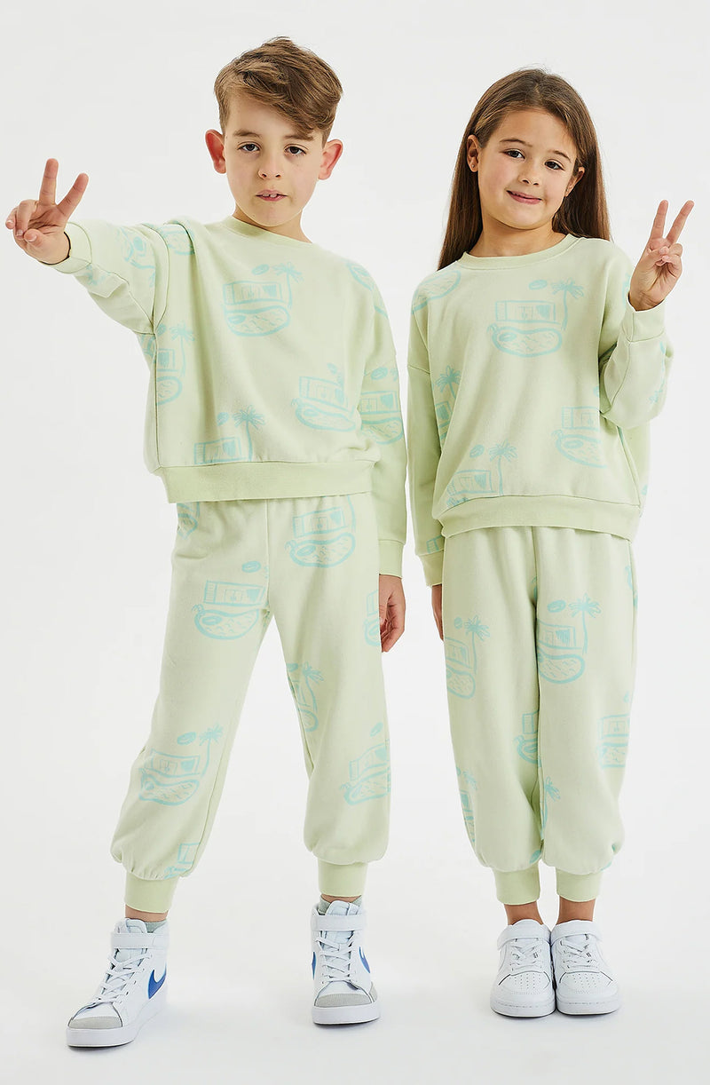 Boy and girl both doing peace signs and both wearing the pool house fleece set