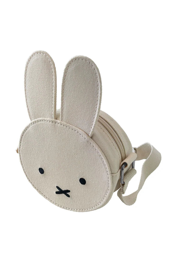 The ENGELITE Engelite - Miffy Canvas Ears Crossbody Bag Off White is a small bunny-face bag with long fabric ears, black embroidered eyes, and an “X” mouth, plus a matching adjustable strap.
