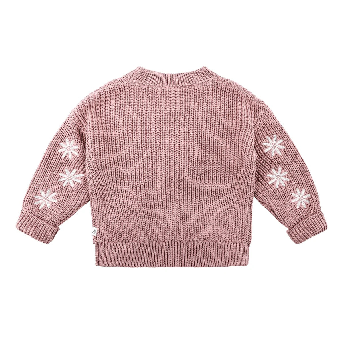 The KYND BABY Embroidered Knit Jumper Wood Rose is a pink organic cotton jumper with long sleeves, featuring white snowflake patterns on the sleeves, shown laid flat with the back side facing up.