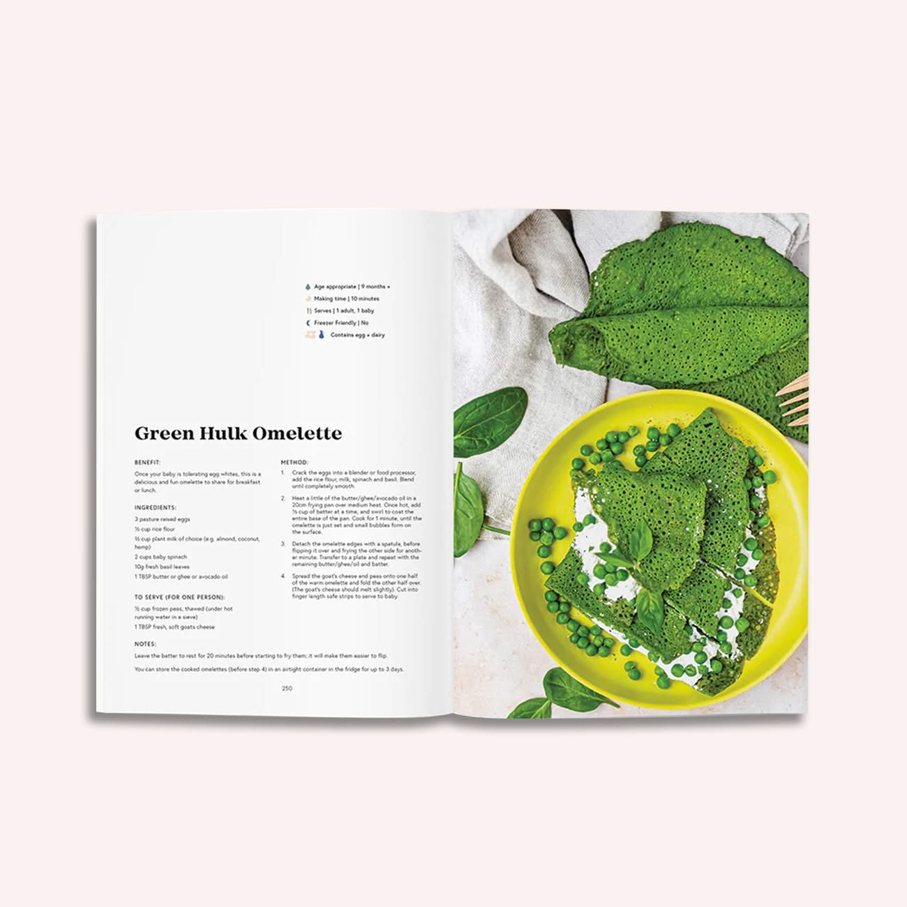 An open copy of "Milk to Meals" by Luka McCabe (Boob to Food) shows a Green Hulk Omelette recipe for baby nutrition on the left page, and a close-up of the omelette with peas and greens on a yellow plate on the right.
