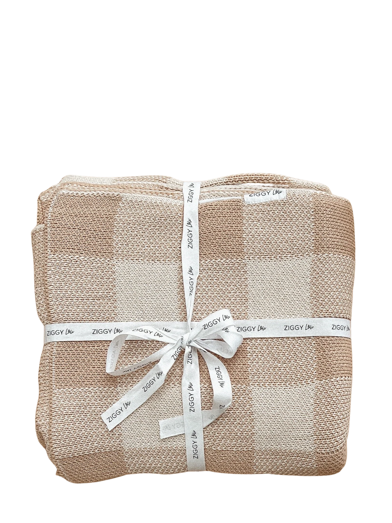 The Ziggy Lou - Blanket Gingham by ZIGGY LOU is a folded beige and white checkered cotton blanket for newborns, tied with a white “ZIGGY” ribbon, displayed against a plain black background.