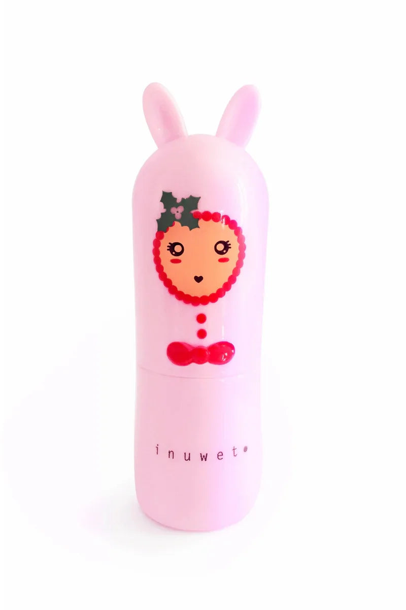 A charming pink Christmas Lip Balm Candy Cane container features bunny ears on the lid and a face design on the front, offering an enchanting Candy Cane balm crafted from natural ingredients. The brand name "INUWET" is displayed at the bottom, ensuring it’s both delightful and cruelty-free.