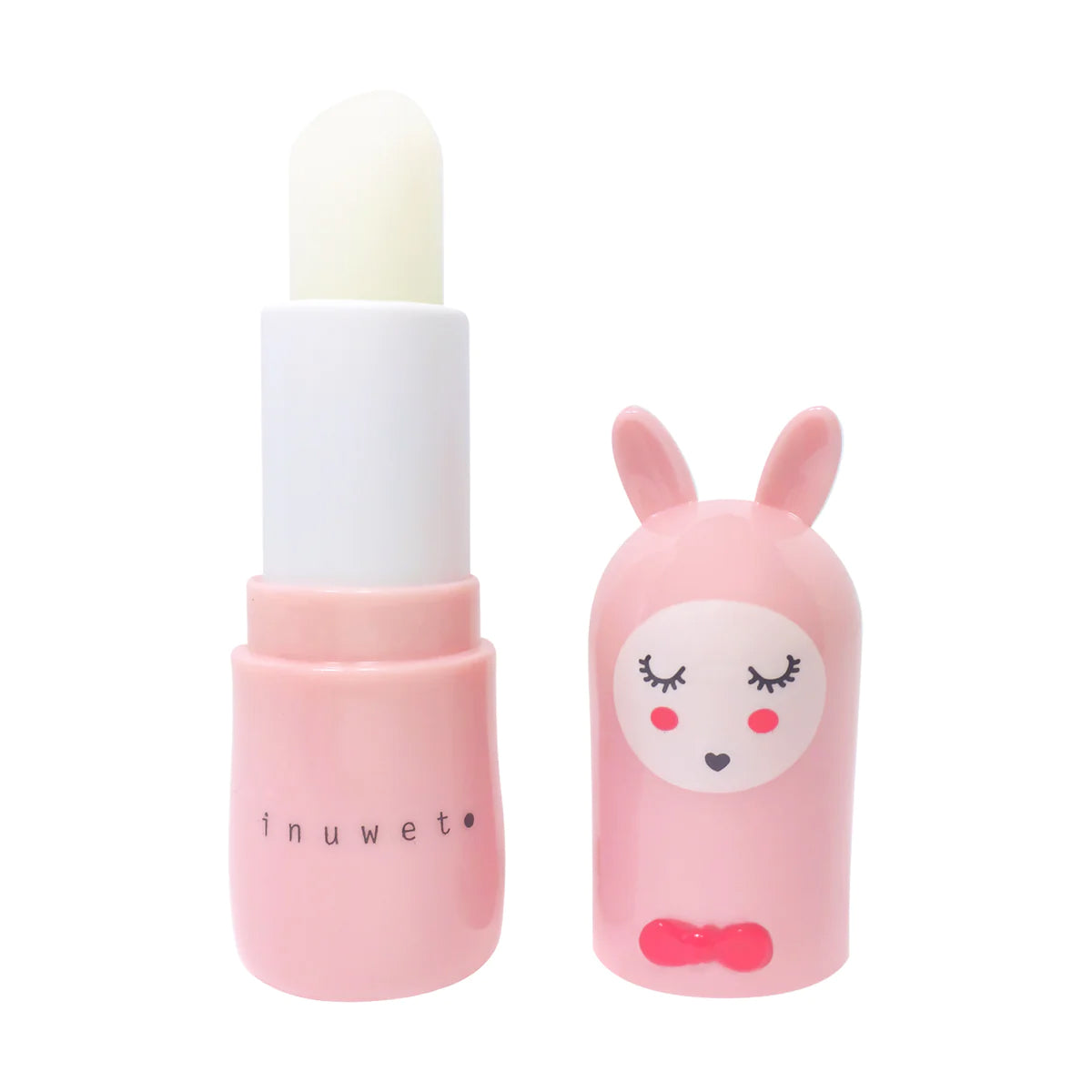 The INUWET Bunny Lip Balm Strawberry features a pink tube containing a white shea butter stick. The cap, designed like a bunny's head complete with ears, face, and a small red bow tie, rests beside the tube. This vegan lip balm exudes the delightful scent of strawberries and cream against a plain white background.