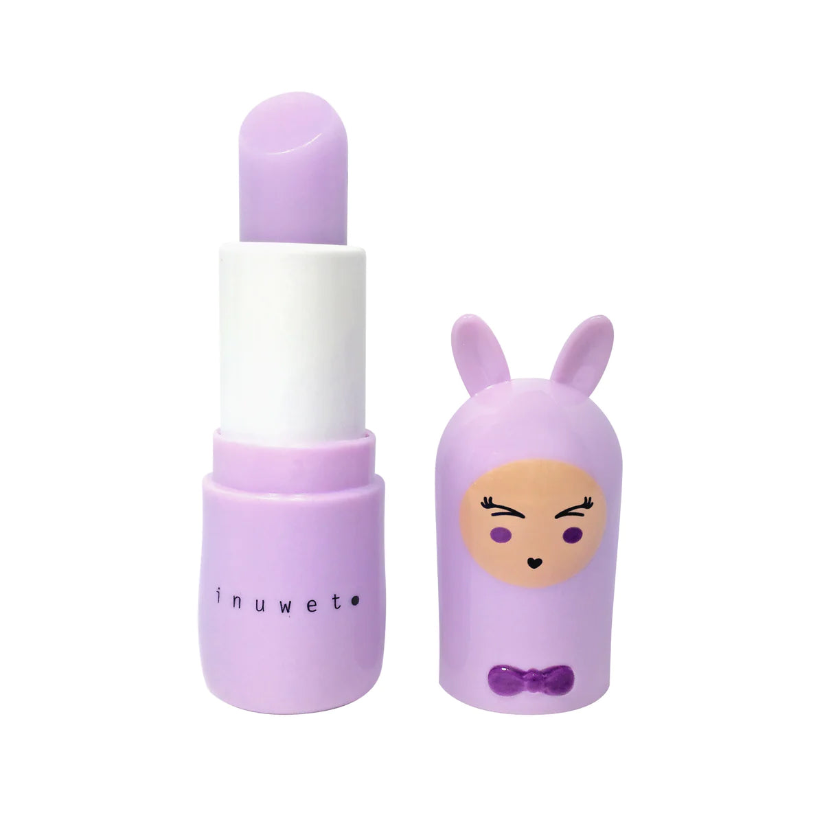 The Bunny Lip Balm Marshmallow by INUWET comes in a light purple lipstick tube with a white middle section. The cap features an adorable character design with a cute face, wearing a purple hood with bunny ears and adorned with a small purple bow. This vegan lip balm is enriched with nourishing shea butter.