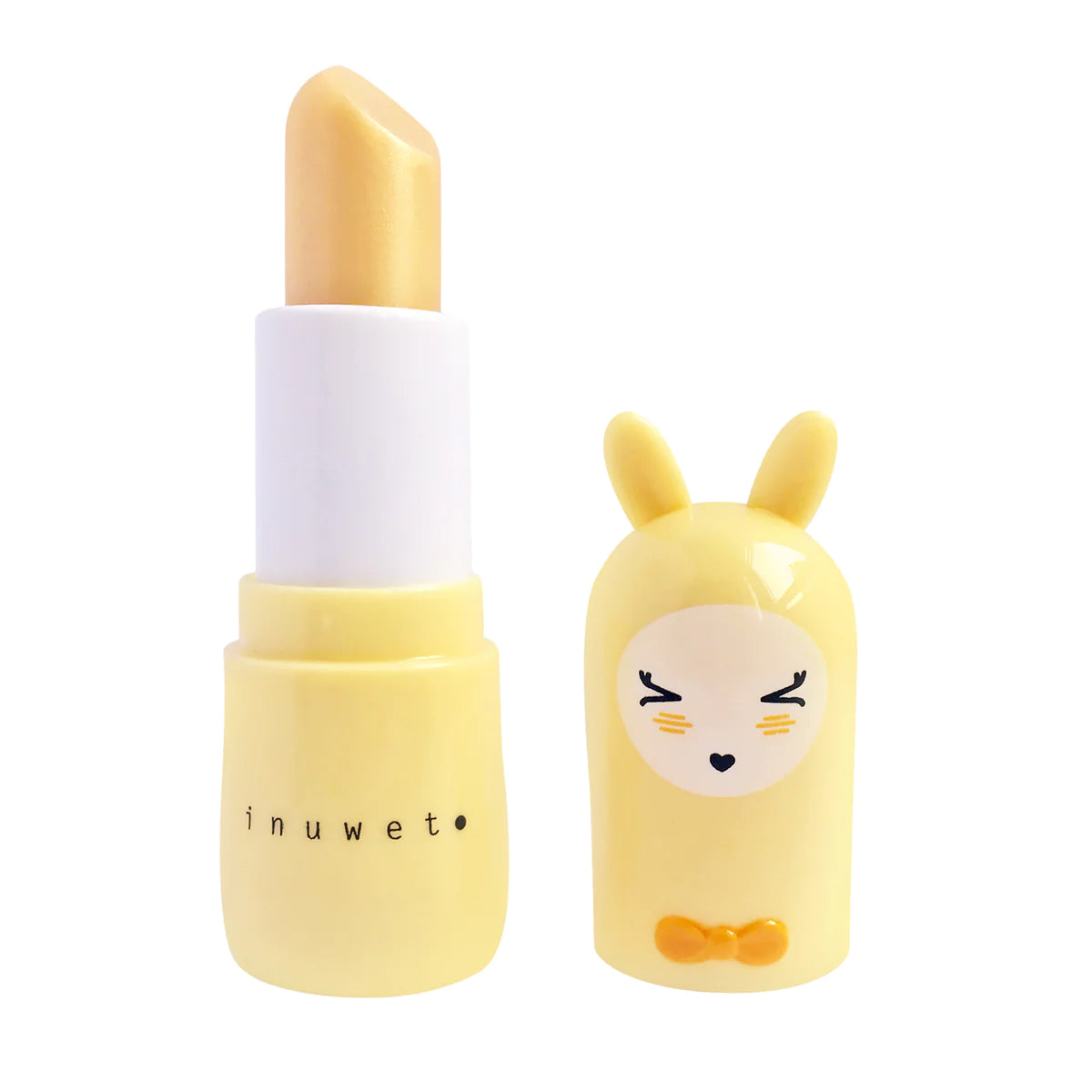 A yellow lipstick tube with a golden yellow cap designed to resemble a cute bunny character with closed eyes, rosy cheeks, and a small bow tie on its neck. The brand name "INUWET" is printed on the tube in uppercase letters. Plus, it's vegan and cruelty-free! This charming packaging contains the Bunny Lip Balm Pineapple from INUWET.