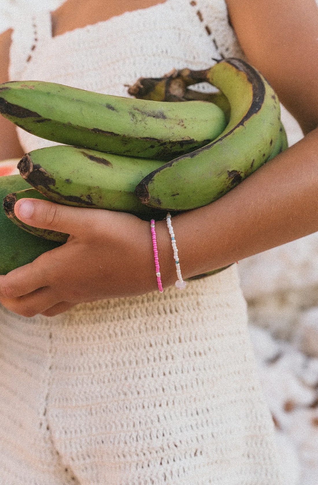 KRYSTLE KNIGHT JEWELLERY  Ocean Tresures Bracelet worn by a girl holding bananas.