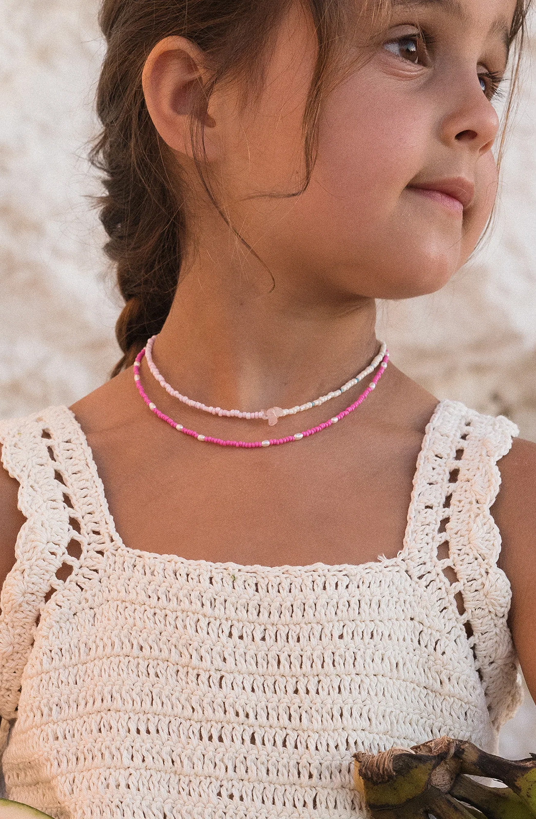 KRYSTLE KNIGHT JEWELLERY Pearl Promesa worn by a young girl.