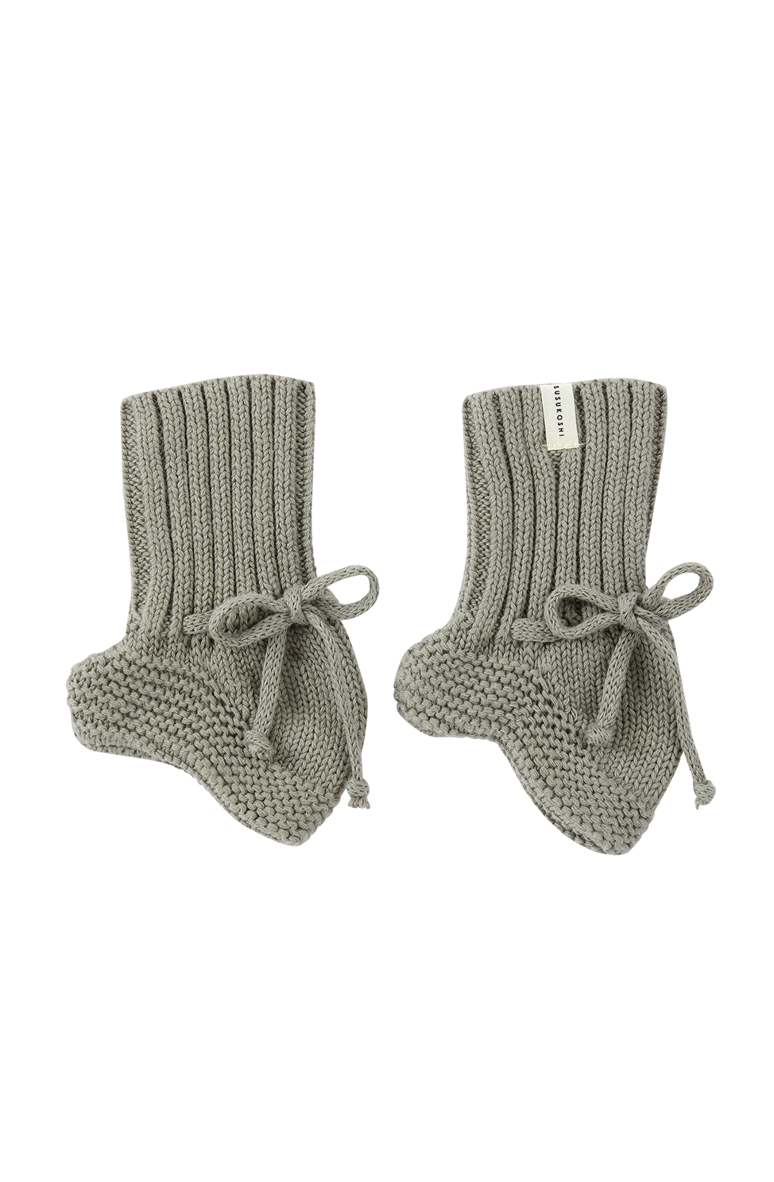 A pair of SUSUKOSHI Knit Booties Gumleaf, crafted from organic cotton with ribbed cuffs and tied bows at the ankles. The booties are neatly arranged side by side on a white background, each adorned with a small label near the top, perfect for a newborn.