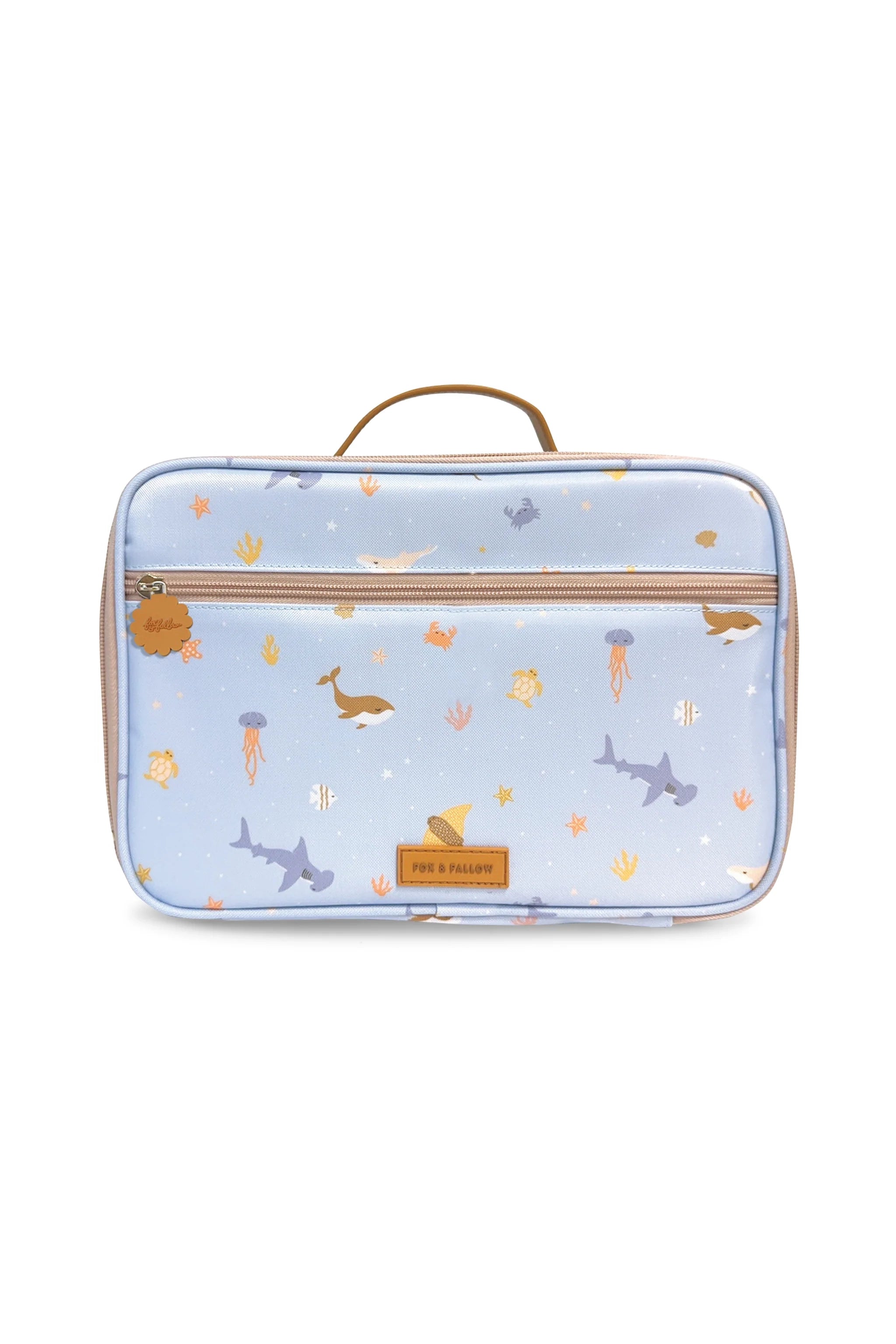 Introducing the Ocean Creatures Sky Lunch Bag by FOX & FALLOW—a light blue, rectangular children's lunch bag with a handle on top. This kid-approved and adventure-ready lunch bag features a whimsical marine design with illustrated whales, sharks, jellyfish, coral, and fish on waterproof fabric. A brown label at the bottom center proudly displays "FOX & FALLOW.