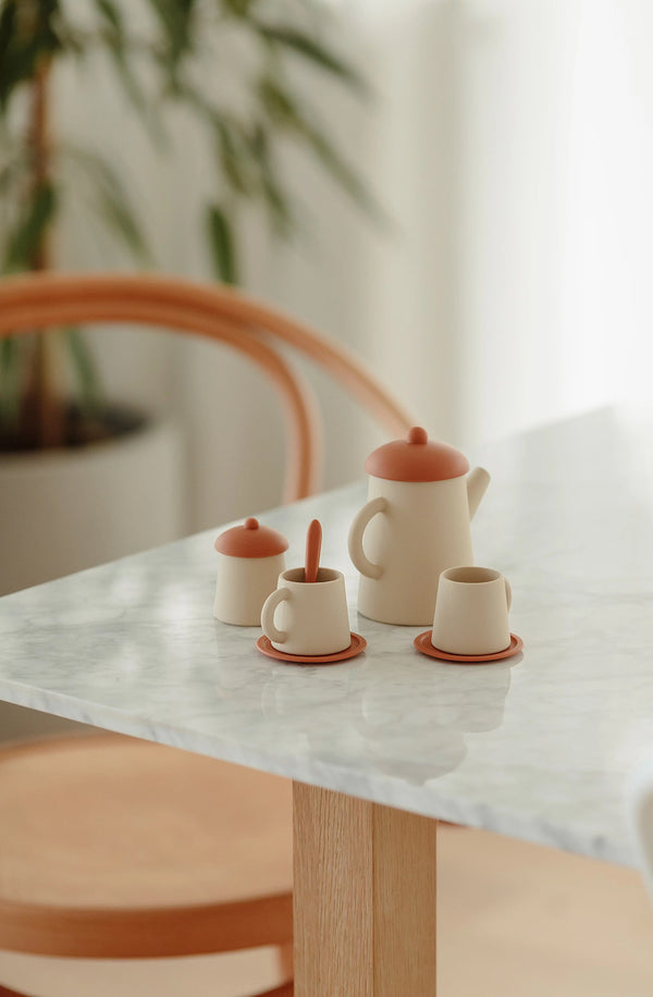 Tea set in Ochre on a marble dining table