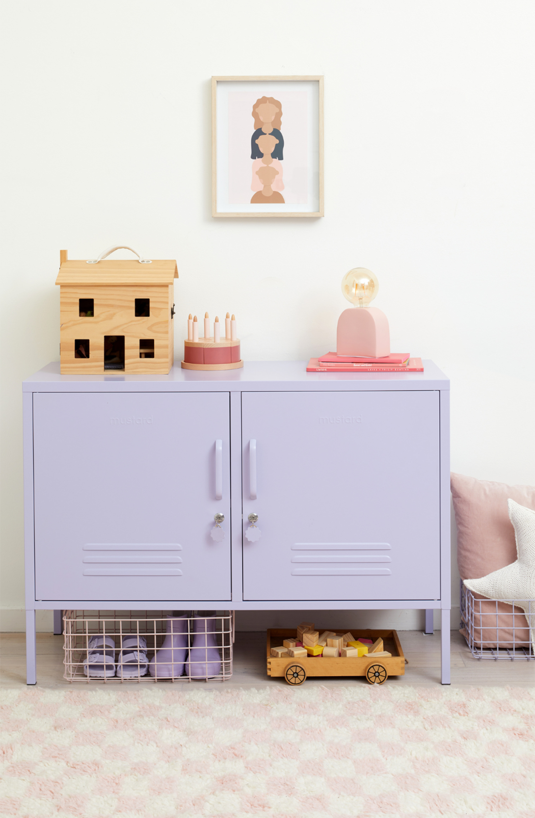 The lowdown locker in lilac in a room with toys on it.