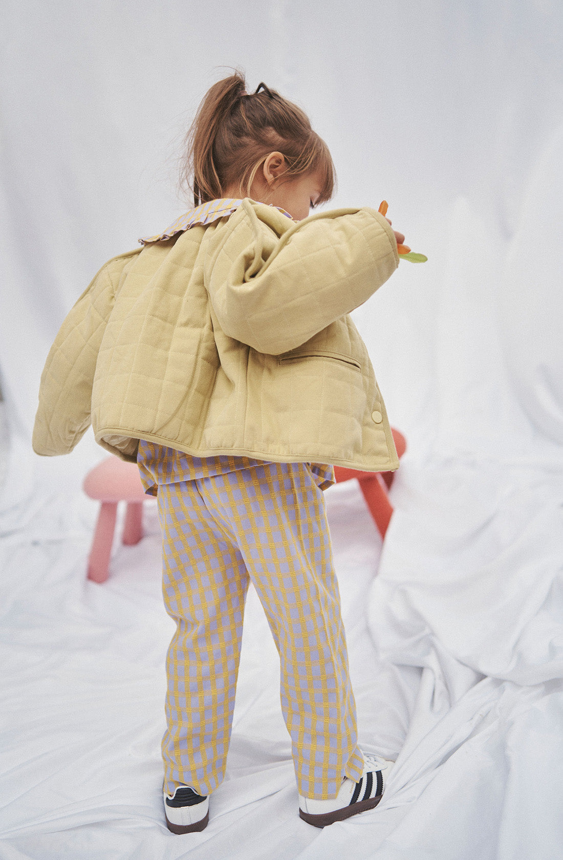 Young kid wearing the parker quilted jacket.