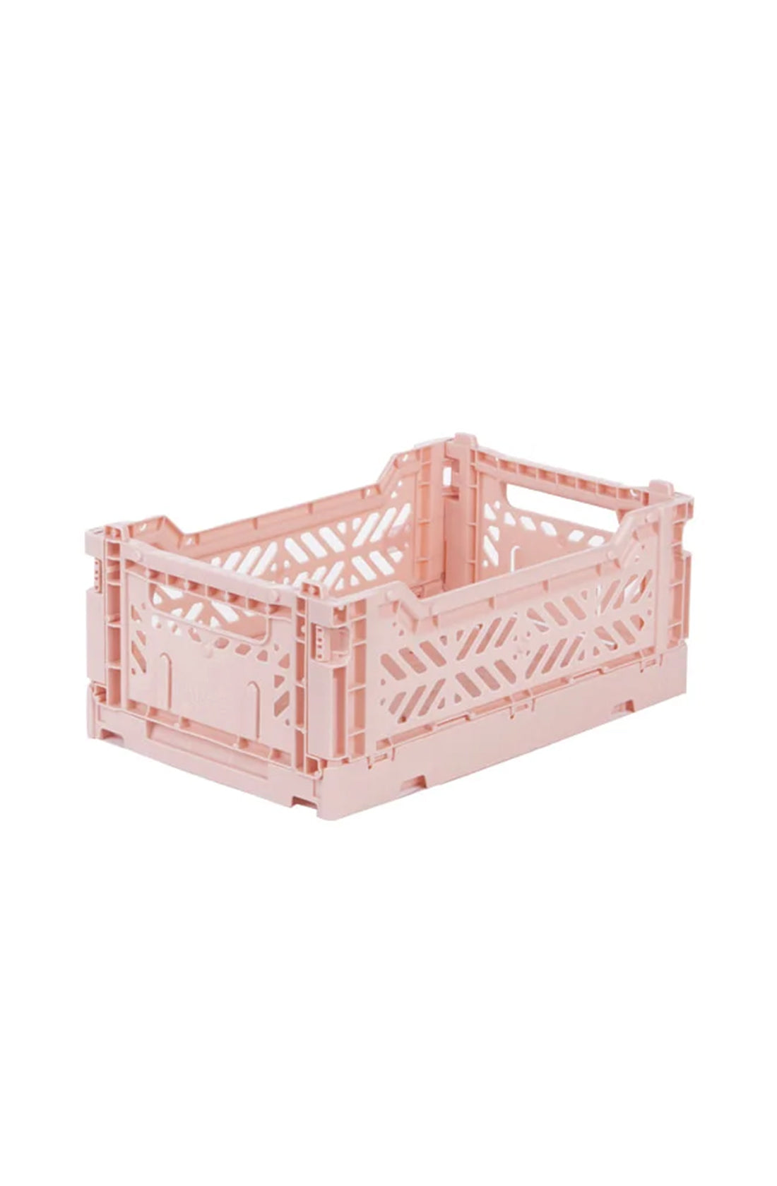 The Mini Storage Crate Milk Tea by AYKASA is a pink plastic storage crate featuring a perforated design on its sides. This rectangular crate has sturdy, interlocking edges, making it ideal for home organizing or office storage. This lightweight Aykasa Folding Crate is perfect for stacking and keeping your items neatly arranged.