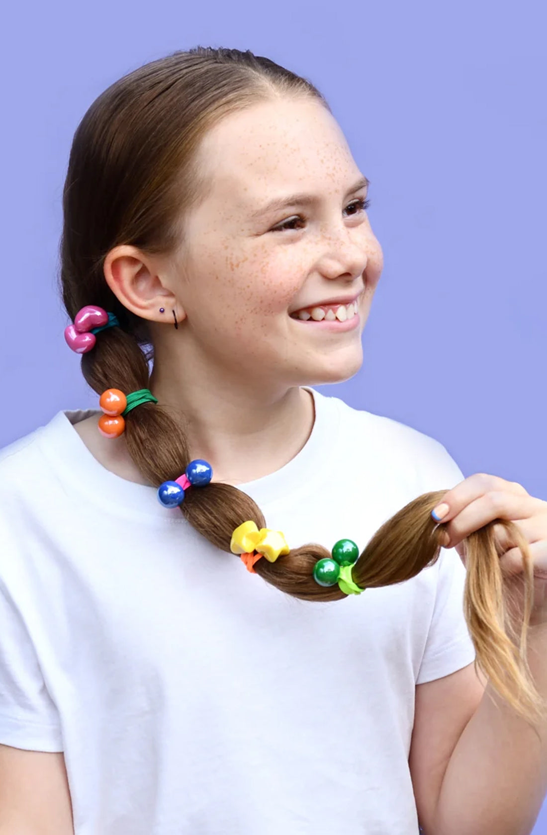 The star bright bobbles hair ties in a young girls ponytail.