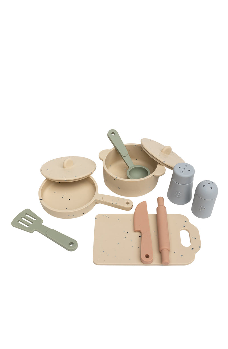 All pieces of kitchen set laid out on white background
