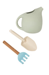 Watering can, hand rake and spade flat laif on white background