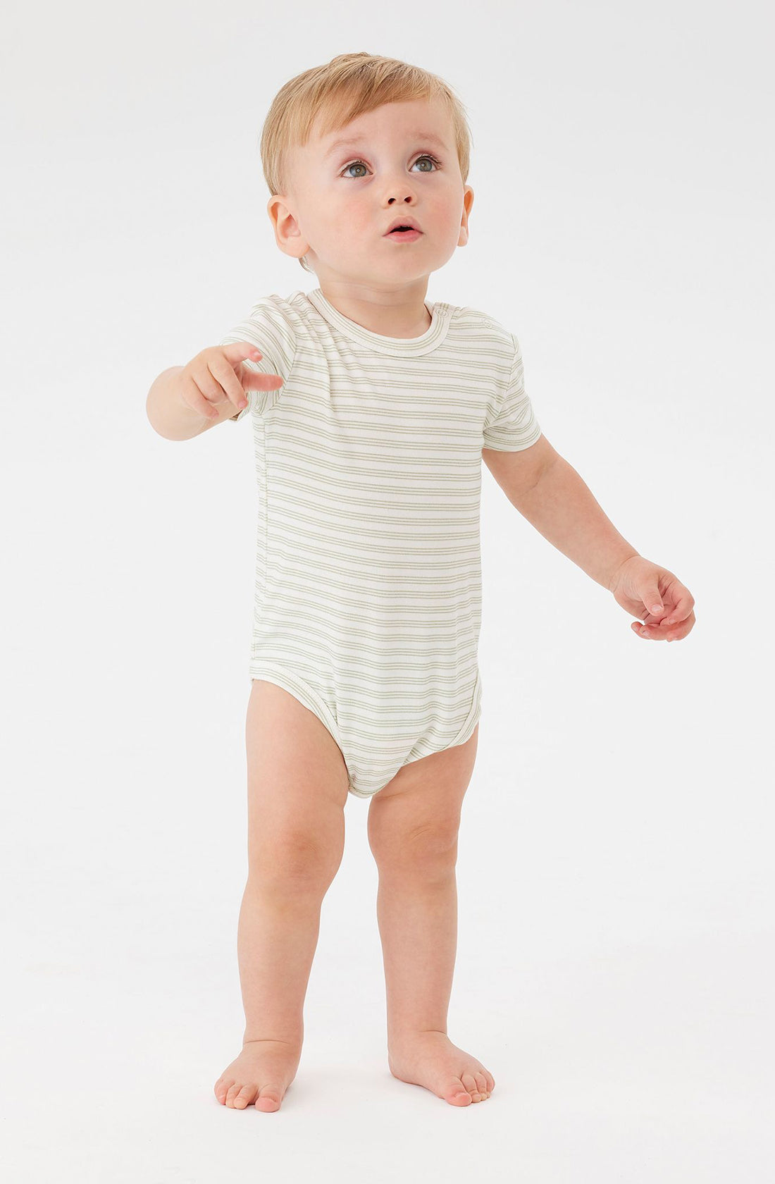 A baby wearing the KYND BABY Comfy Bodysuit Short Sleeve Sage Stripe.