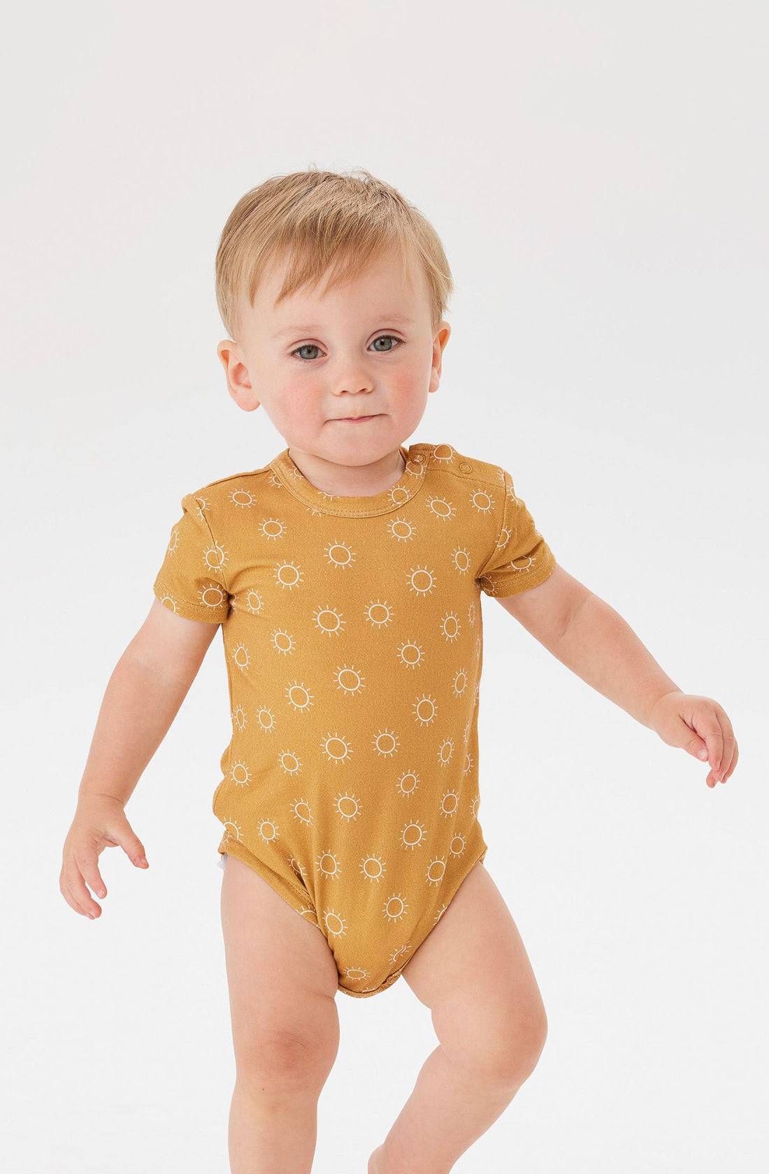 A Toddler wearing the KYND BABY Comfy Bodysuit Short Sleeve Sunrise.