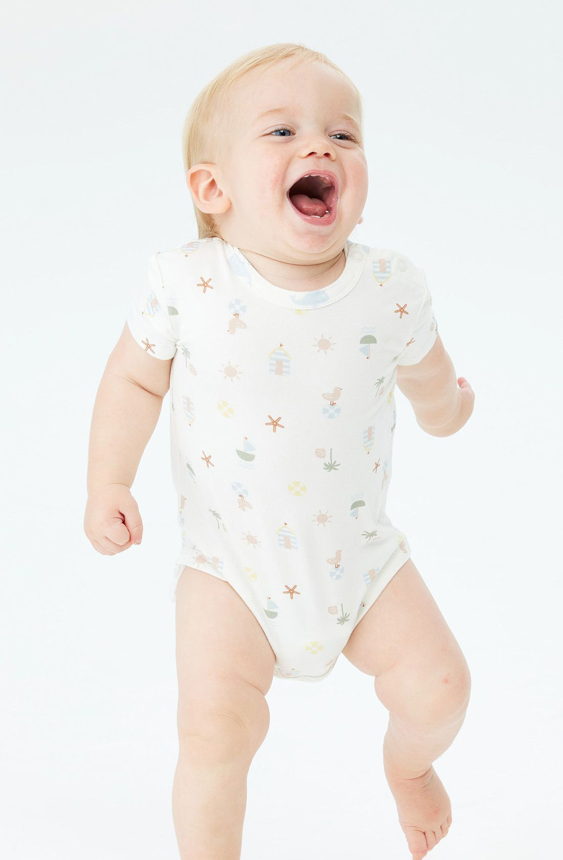 A Toddler wearing the KYND BABY Comfy Bodysuit Short Sleeve Vacay.