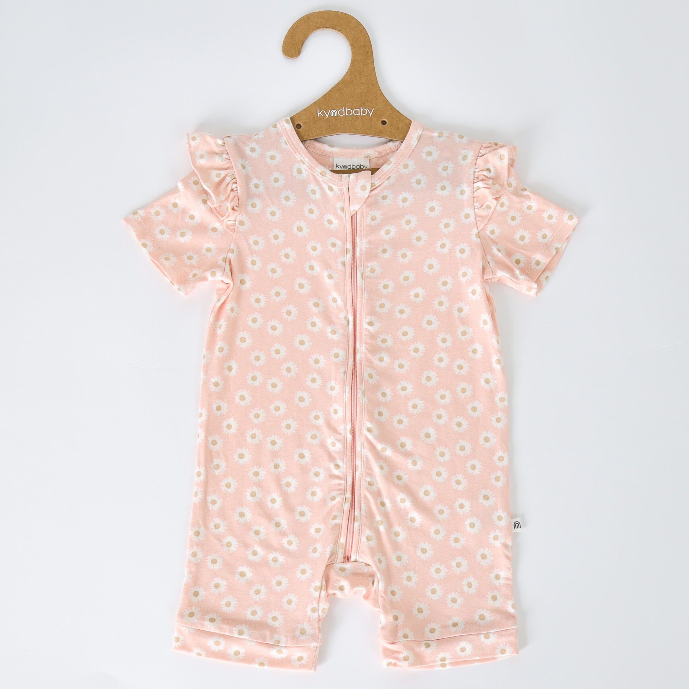 The Day or Night Short Sleeve Frill Onesie Daisy Charm on a coat hanger.