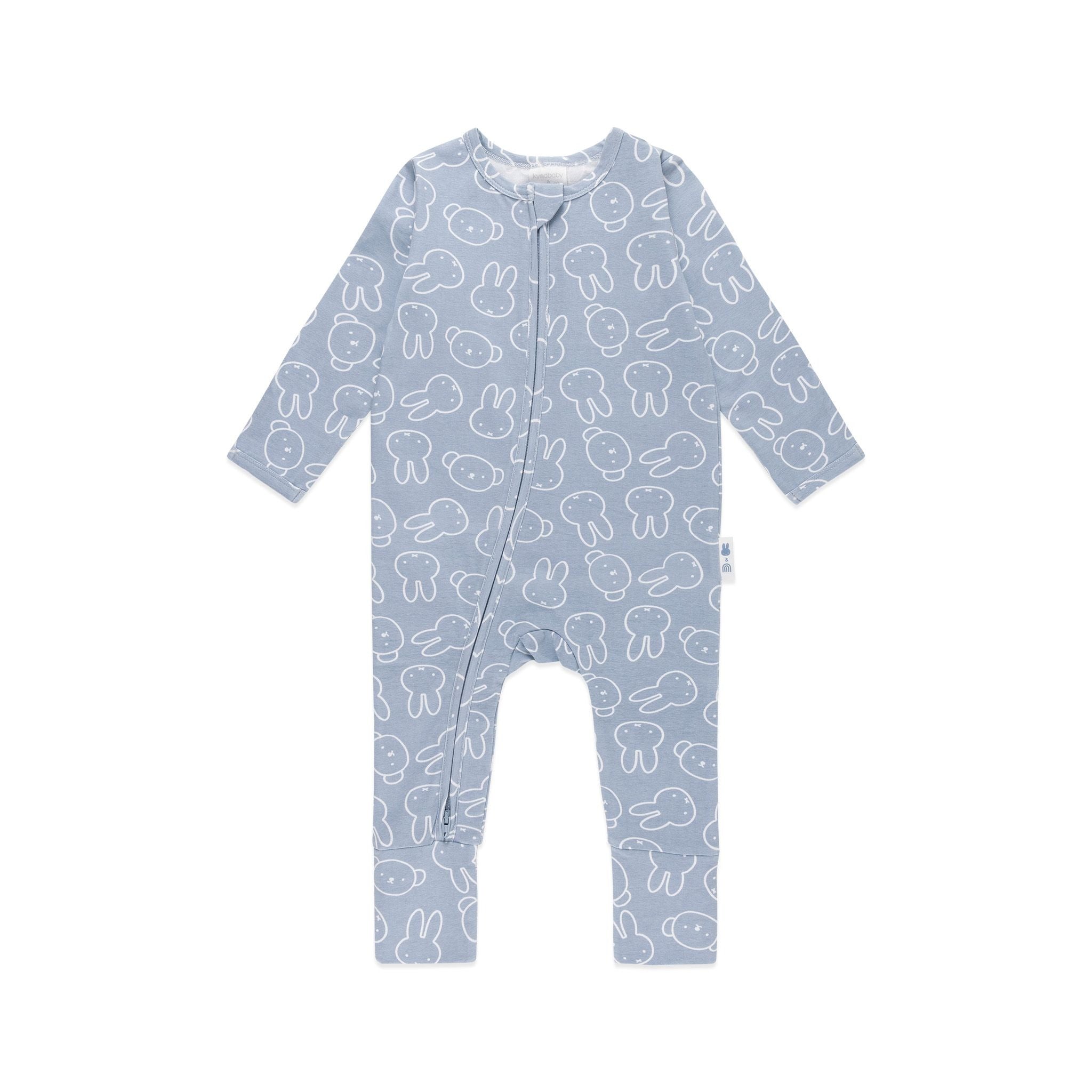 The KYND BABY Kynd Baby - Miffy Day Or Night Onesie in Moody Blue is a long-sleeve, light blue zip-up onesie with white cartoon animal faces and outlines, plus a diagonal front zipper from collar to leg.