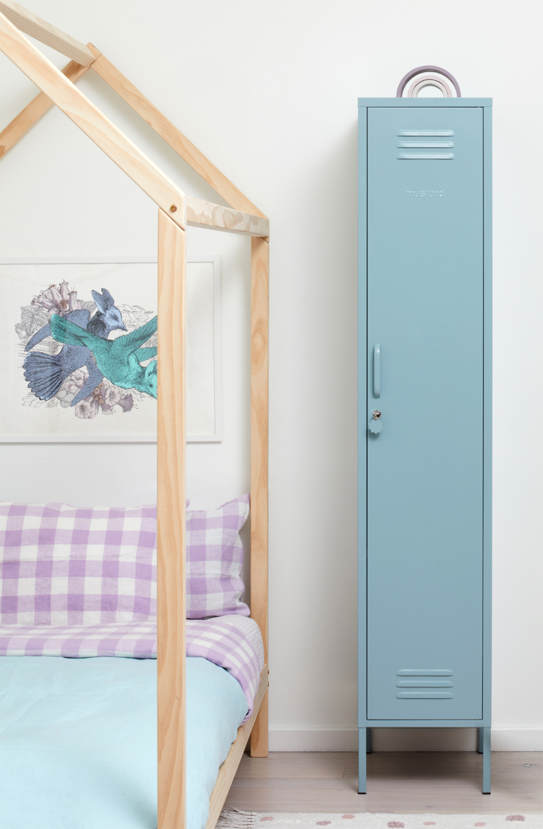 The skinny locker in ocean next to a bed.