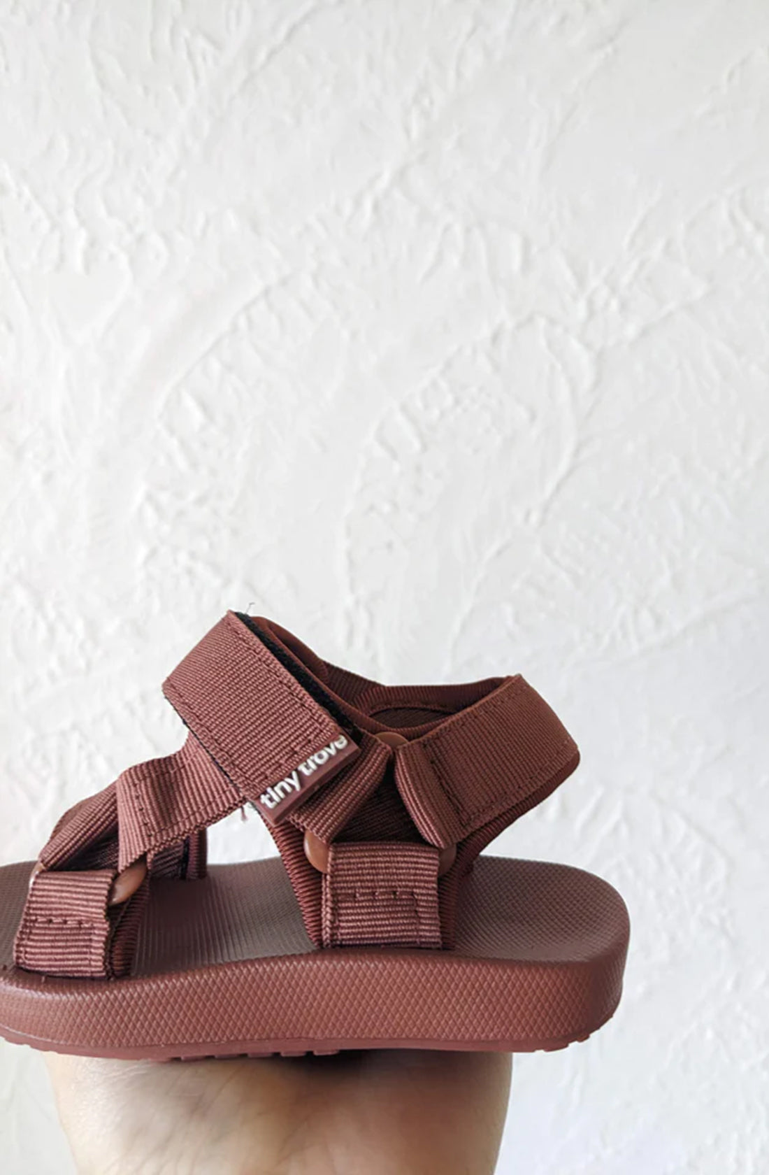 Close up of logo detail on brick sandal