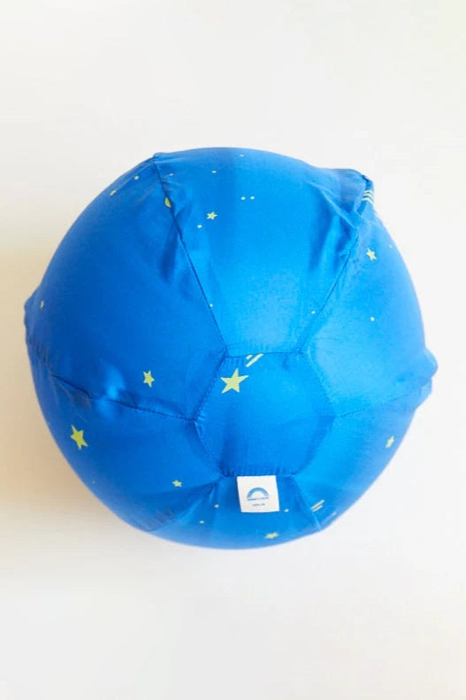 The Starry Night Balloon Ball by SARAH'S SILKS is a blue ball with a silk cover, decorated with yellow stars and visible stitching lines, set against a plain white background.