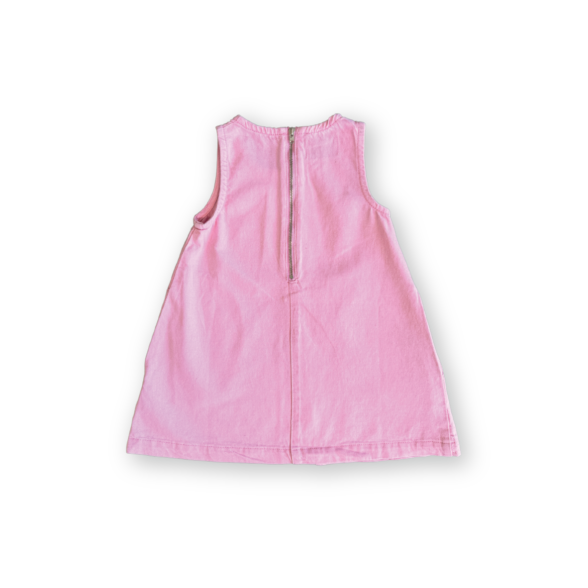 The GROWN Organic Shift Denim Dress Candy is a sleeveless, light pink organic cotton dress with an easy back zipper, shown on a plain white background.