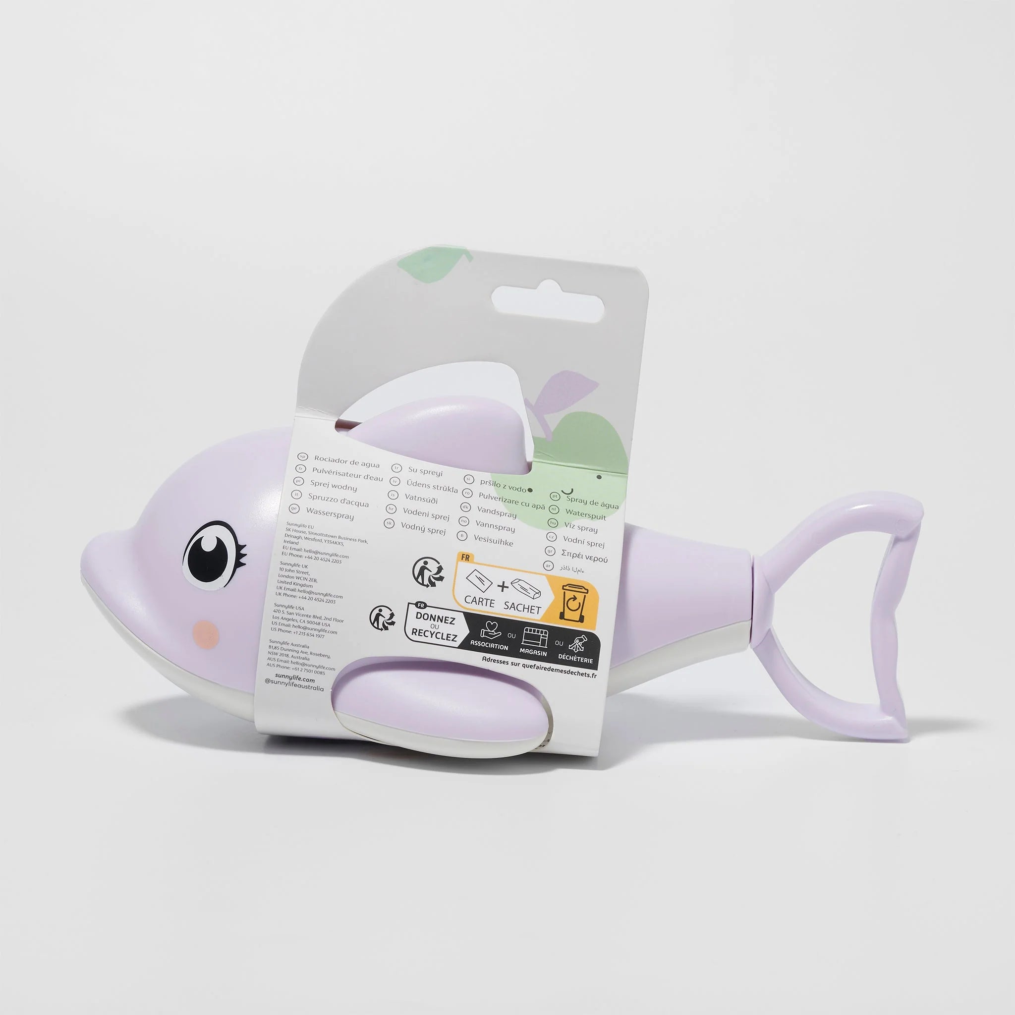 Photo of the Dolphin Water Squirter, a pastel purple plastic toy shaped like a fish designed for fun and practicality. The packaging by SUNNYLIFE features icons and text in multiple languages, indicating safety, recycling information, and usage instructions. It also includes a hand pump squirter for added enjoyment.