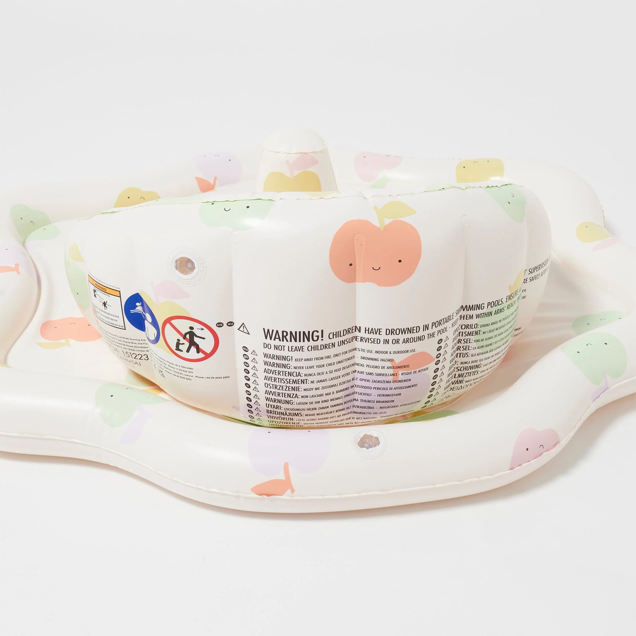 The Baby Playmat with Shade by SUNNYLIFE, featuring an adorable peach-themed print, is crafted from durable non-toxic PVC. Safety warnings and instructions are clearly visible on the playmat's interior wall. The playmat is deflated and laid flat on a white background.