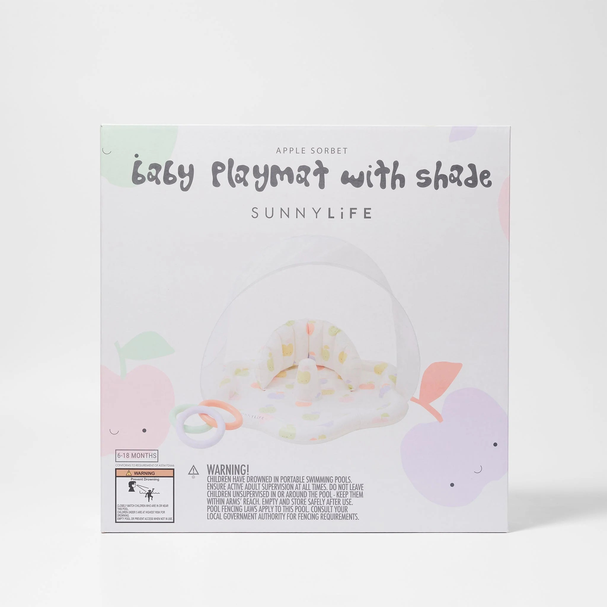 A square box displays the "SUNNYLIFE Baby Playmat with Shade." The packaging showcases a polka-dot patterned baby playmat made of durable, non-toxic PVC, along with toys designed to enhance hand-eye coordination. Below the image, there is a warning notice and an age indication of 0-18 months. The design features pastel colors and playful apple graphics.