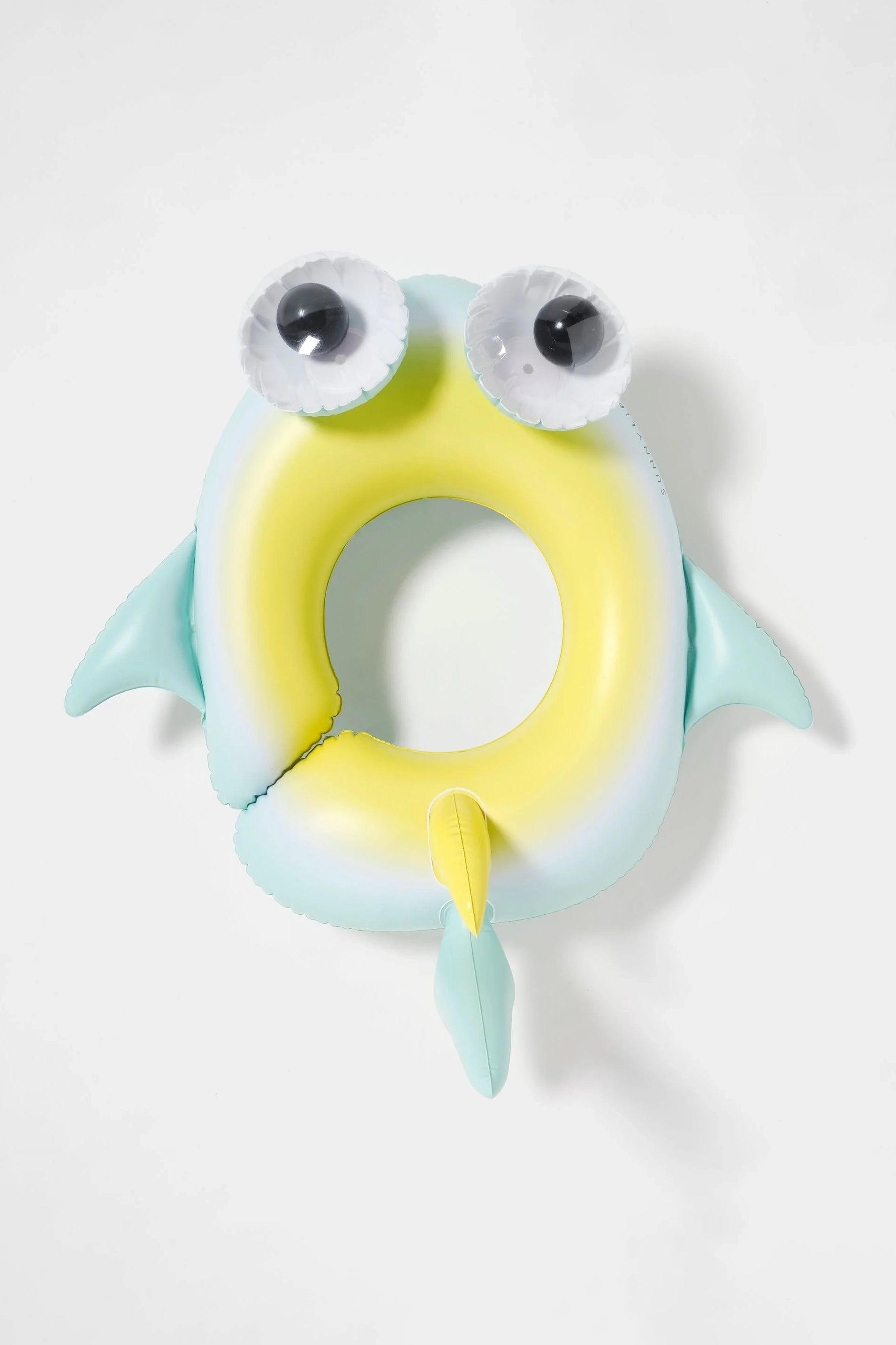 Introducing the Kids Tube Pool Ring Salty the Shark by SUNNYLIFE: An inflatable pool float designed to resemble a shark with fun, cartoonish features. Crafted from durable PVC, this float boasts light blue fins and tail, a yellow belly, and light green sides. The head and tail showcase playful details including large, round googly eyes. It also comes with a repair patch for quick fixes.