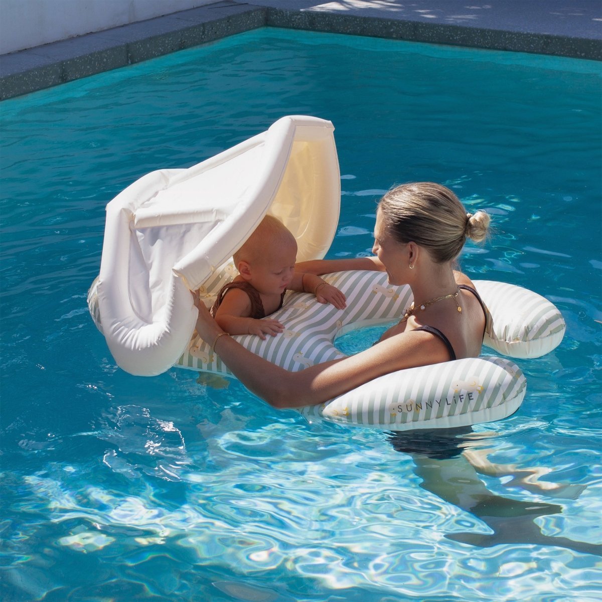 SUNNYLIFE Float Together Baby Seat Duck Sage Stripe lifestyle shot