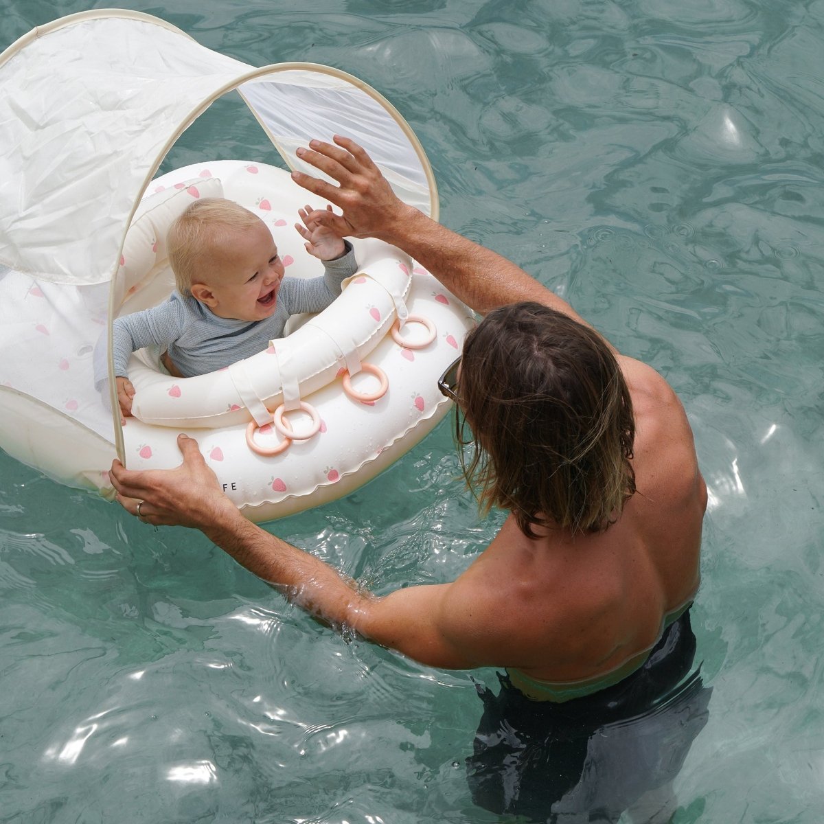 SUNNYLIFE Interactive Baby Float Strawberry Sunshine Pink lifestyle shot