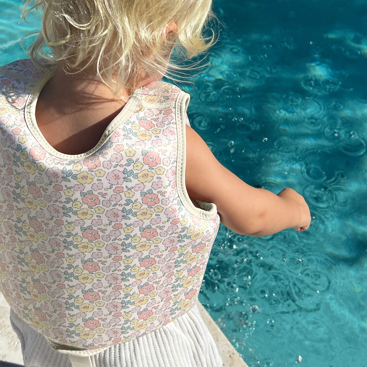 SUNNYLIFE Kids Swim Vest Into the Garden Ditsy Floral lifestyle shot